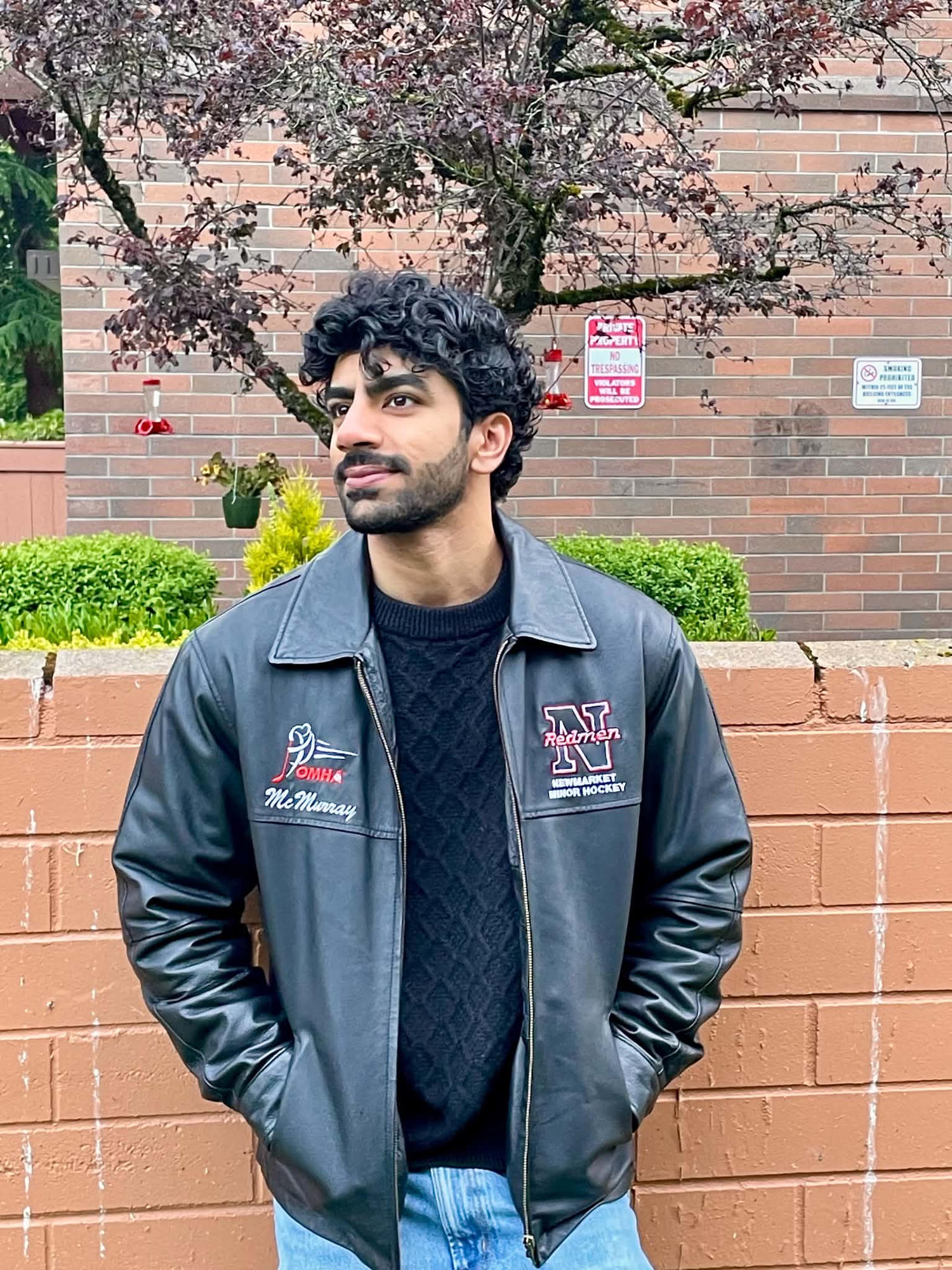 Aditya in a leather jacket